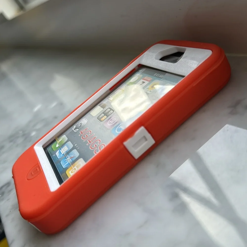 Orange over white defender case for iPhone 4/4s